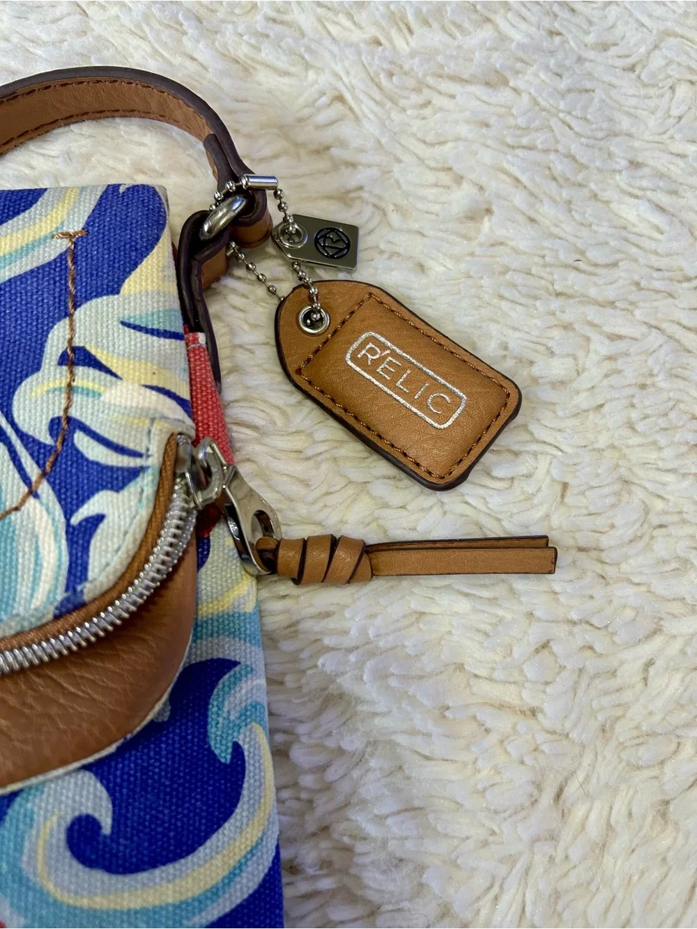 Relic floral canvas Crossbody handbag adjustable strap with a fold-over flap